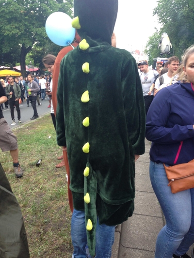 Someone wearing a dinosaur suit