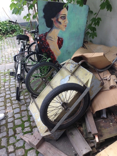 Street art next to a pile of junk