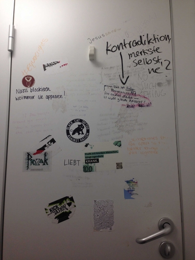 Picture of bathroom door graffiti
