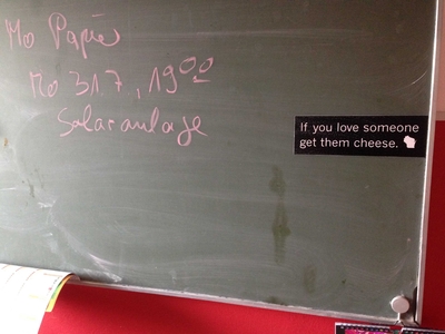Chalkboard with magnet that reads: If you love someone get them cheese.