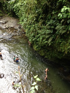 Standing at the edge of the river after the jump