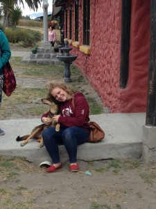 Sarah sitting with a dog