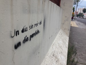 Graffiti that reads: A day without smiling is a day lost