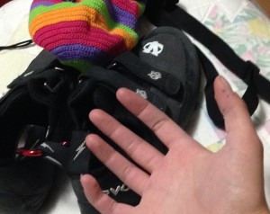 My hand in front of my climbing gear