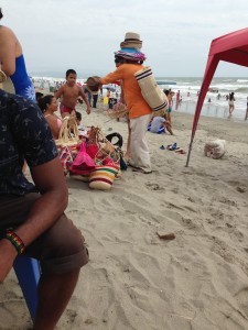 Man selling hats on the beach