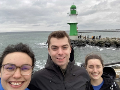 Kate, Maggie and Adam with the Warnemünde Lighthouse