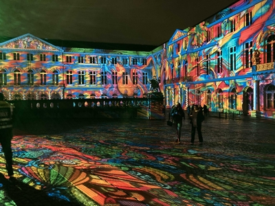 the castle courtyard with projections of colored light