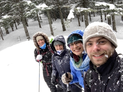 Madeline, Maggie Kate and Adam skiing in a blizzard