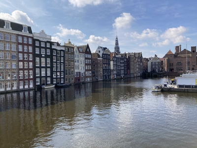 A typical Amsterdam canal with the house right up against the water