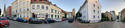A panorama shot of a Rostock intersection with all 3 main churches visible