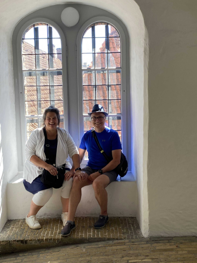 Jim and Martha sitting in a window alcove on the way up the round tower
